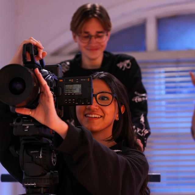 A girl filming.