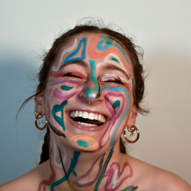 A student with colorful face paint.