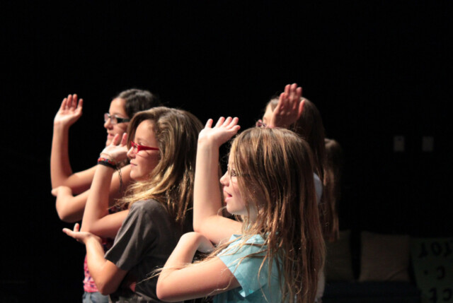 Kids performing in a musical.