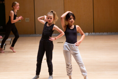 Two girls performing modern dance.