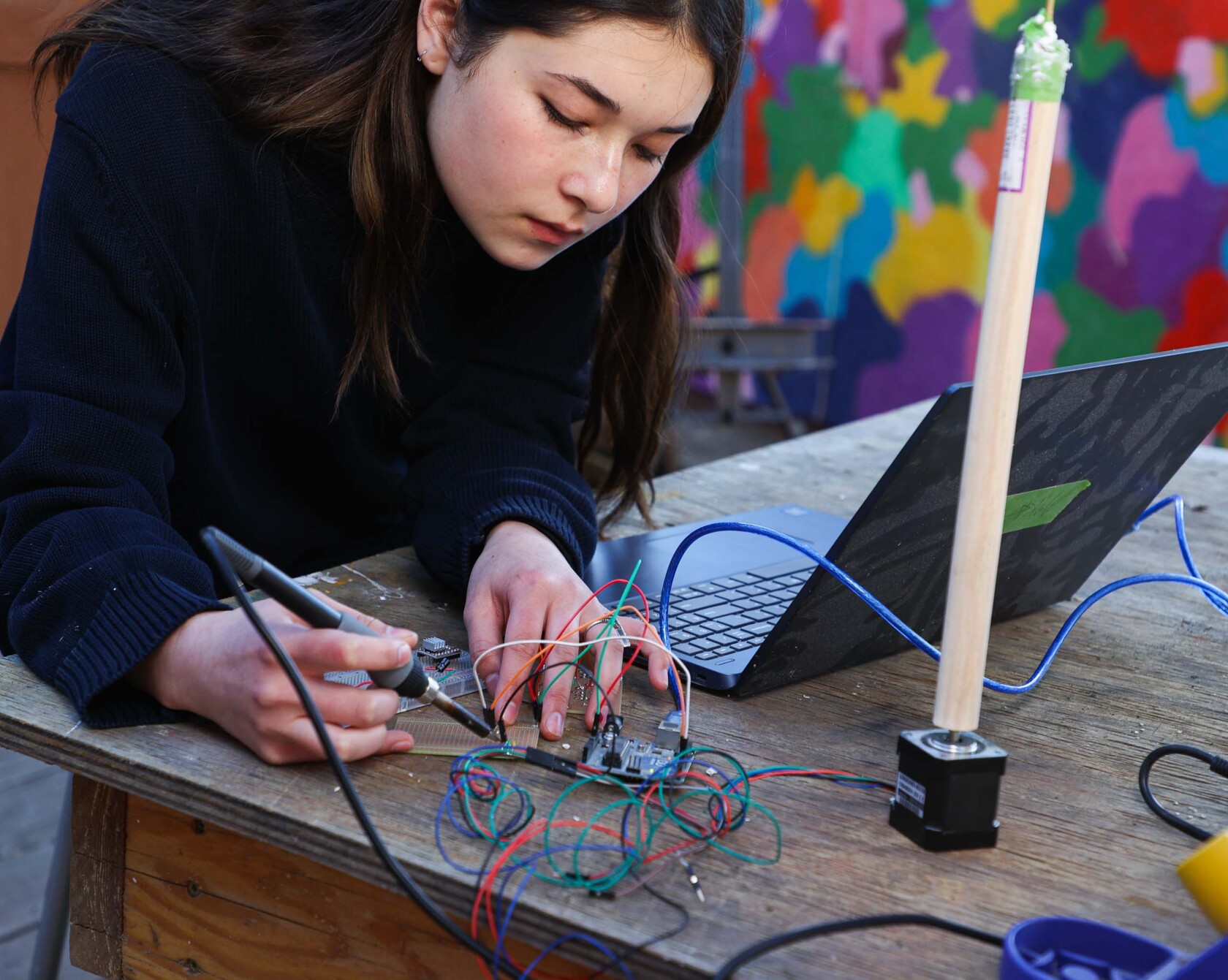 A student working with wires.