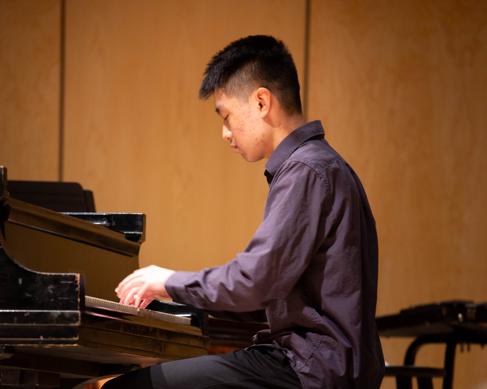A student playing piano.